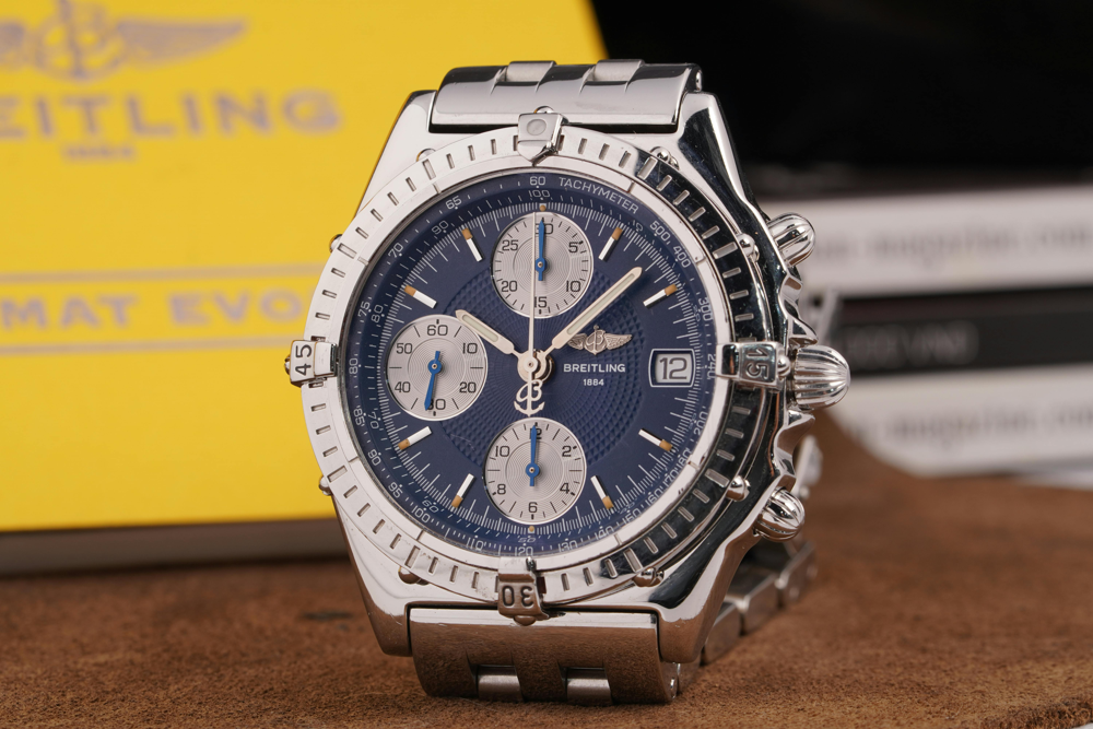 Breitling Navitimer chronograph with slide rule bezel on a pilot’s wrist